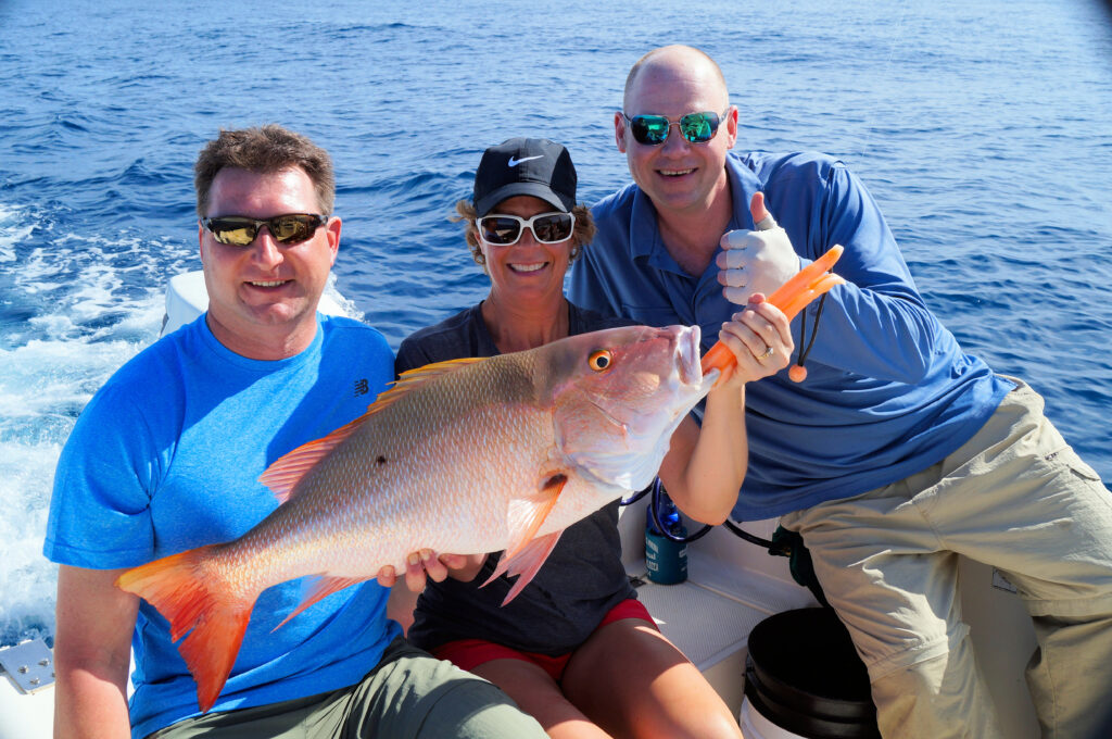 She backs it up with a giant mutton snapper that came home for dinner